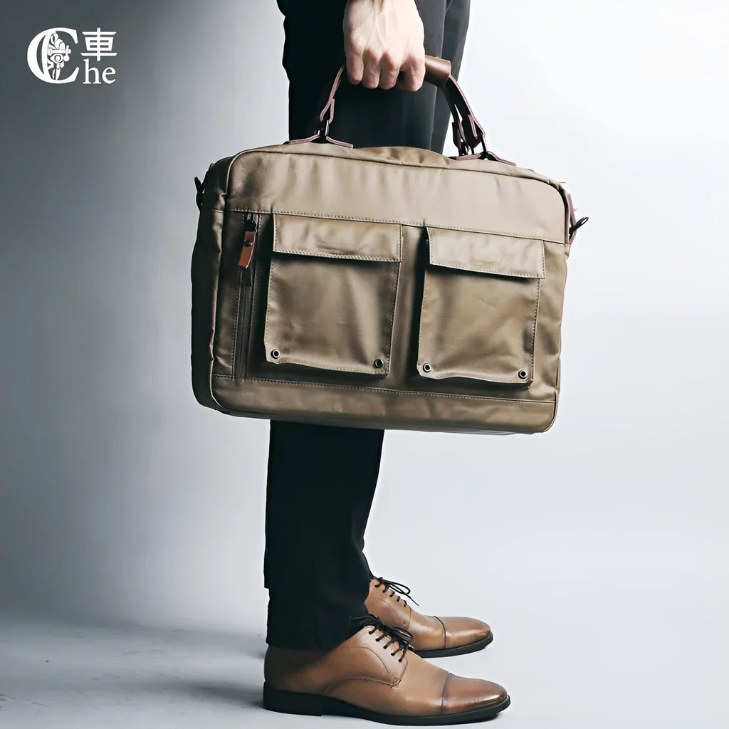 Dpark black laptop shoulder bag for a 14 or 15 inch business laptop, showing front pocket and strap.