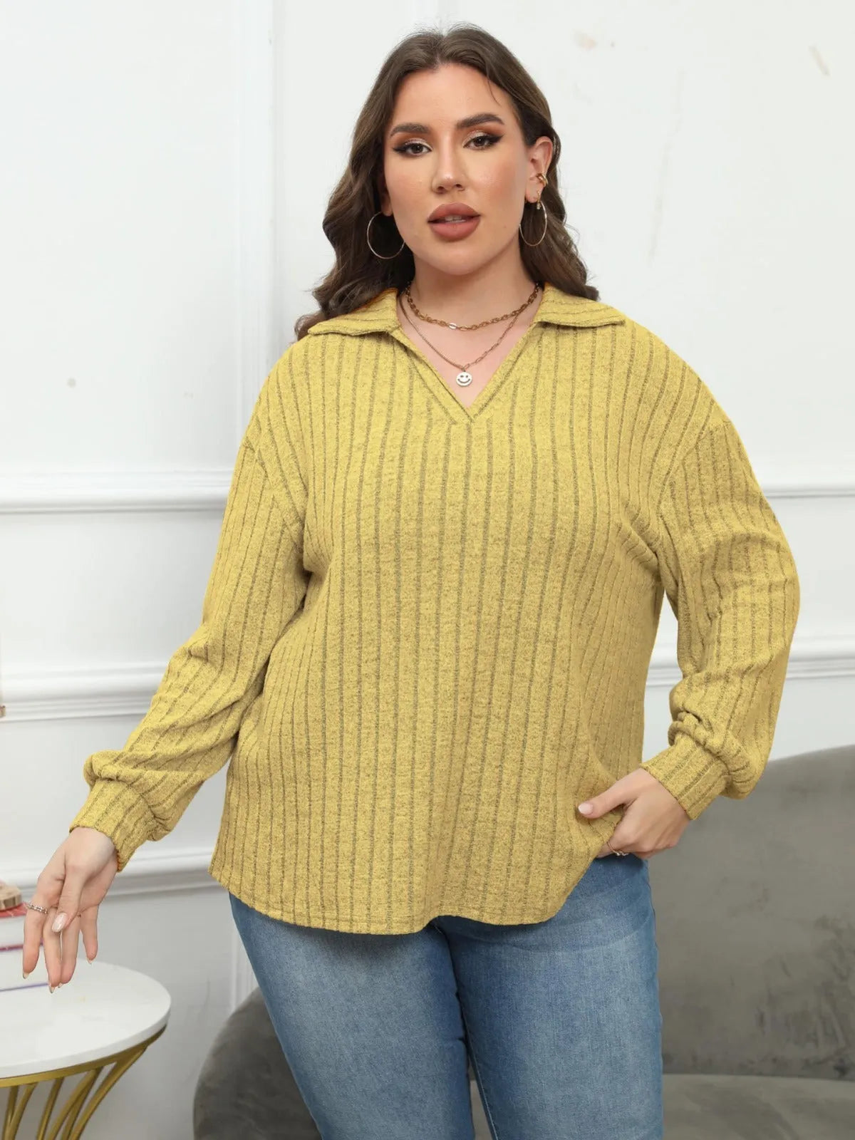 Plus size women's grey polo collar shirt with lantern sleeves in a street fashion style.