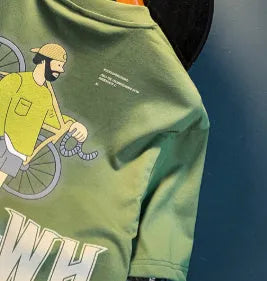 Green men's loose fit t-shirt with a printed design and short sleeves.