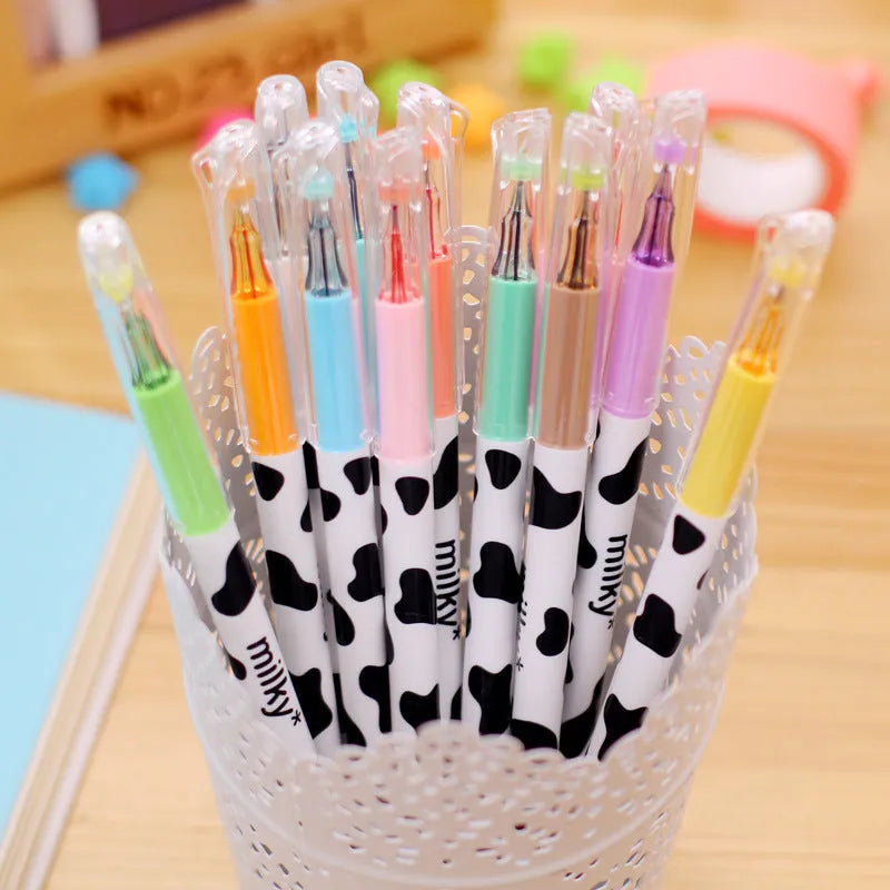 Box of 12 cow colour gel pens with 0.38mm tips showing assorted plastic barrels.