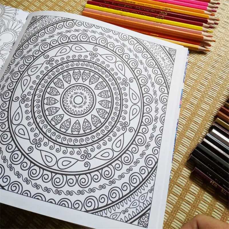 A5 mandala colouring book open showing black ink patterns on white paper with soft binder cover
