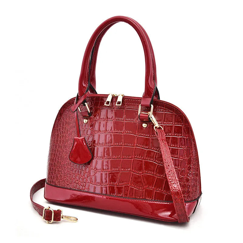 Large shiny black PU leather crossbody bag with shell shape and adjustable strap