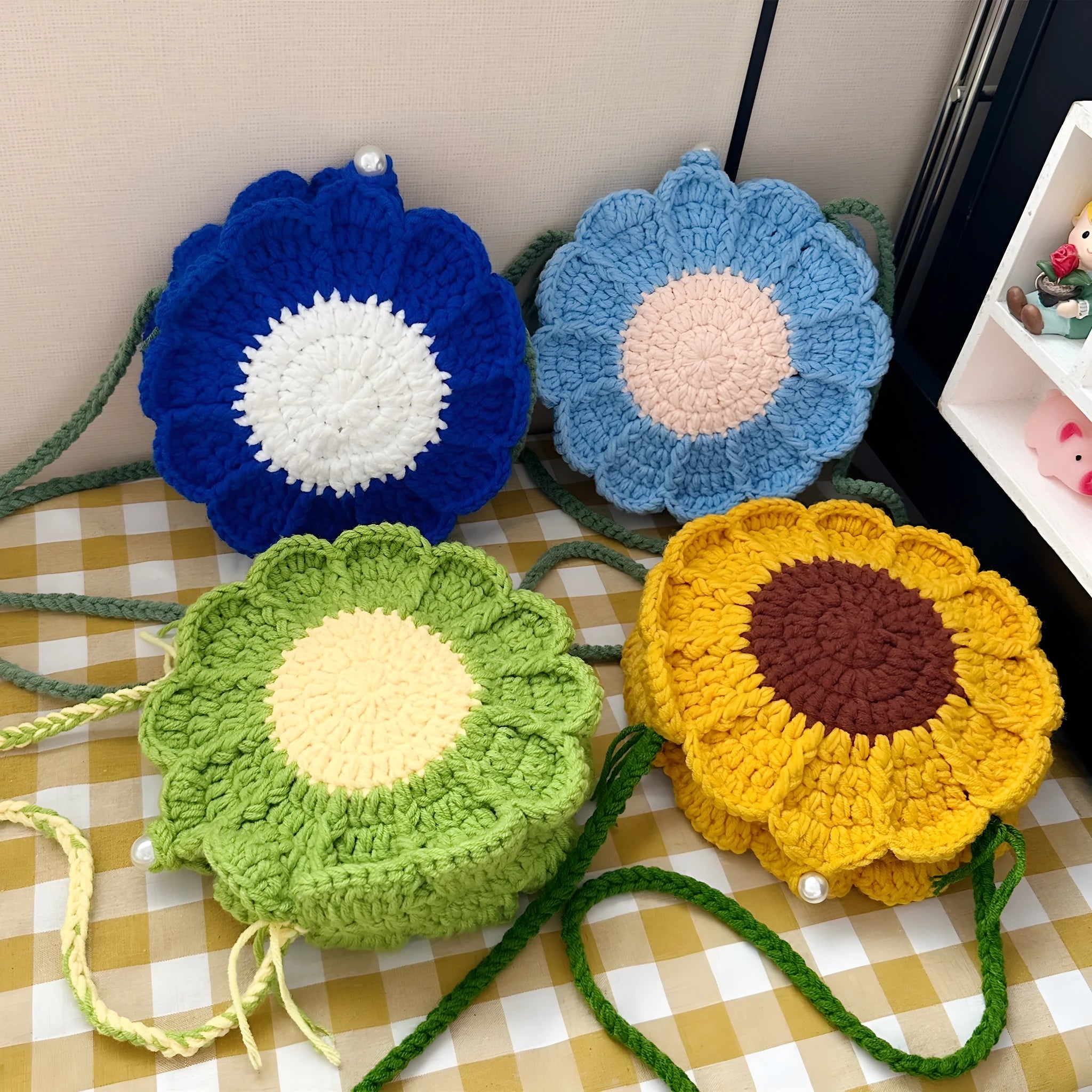 Hand-woven crochet shoulder bag with floral design, cotton lining, and internal phone pocket