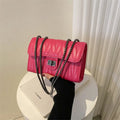 Small textured diamond pattern PU crossbody bag in multiple colours showing front slit pocket.