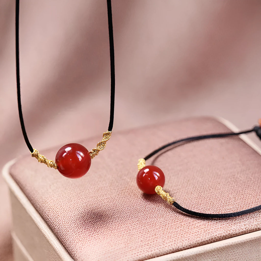 Women's natural red agate bracelet and necklace set with hand-woven construction and bean charms