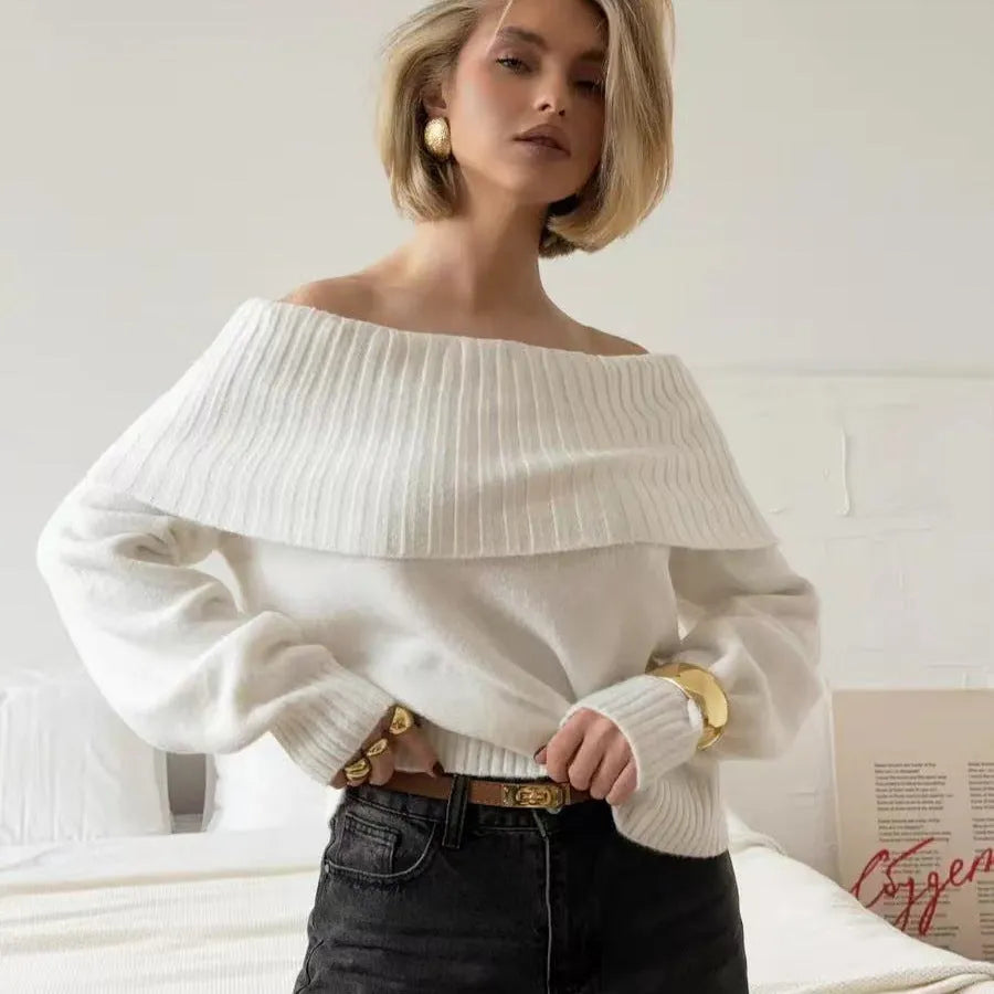 Grey off-the-shoulder pullover sweater with a textured 3D pattern on the front.