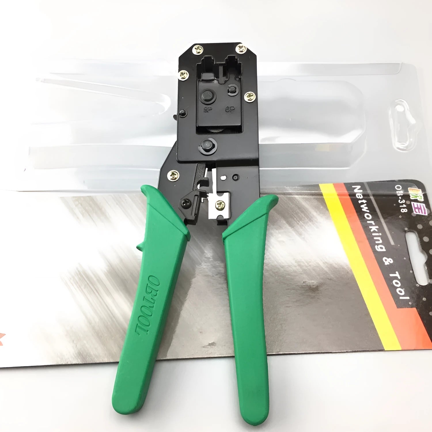 Green dual-purpose crystal head net pliers with tool steel crimping jaws on a white background