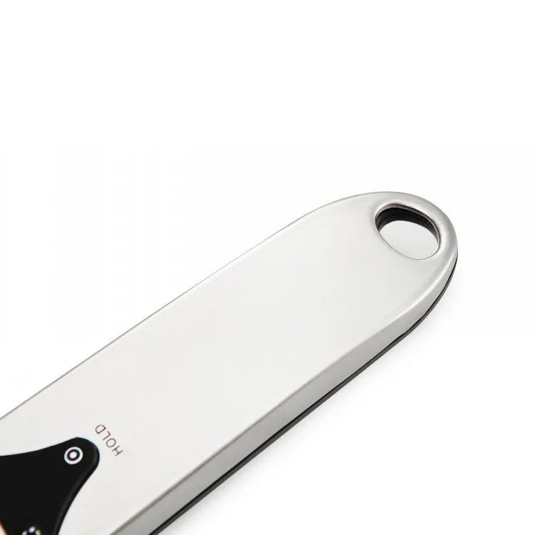 Stainless steel smart digital measuring spoon with a black LCD display showing weight measurement.