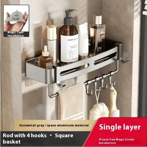 Gun grey metal fan-shaped corner bathroom shelf mounted punch-free on a wall, holding bathroom toiletries.