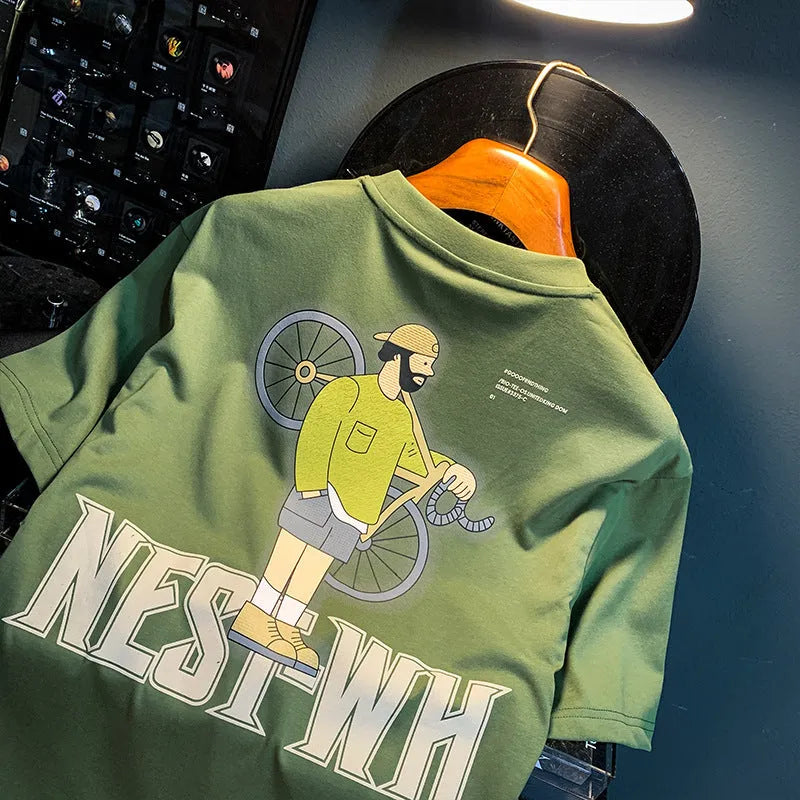 Green men's loose fit t-shirt with a printed design and short sleeves.