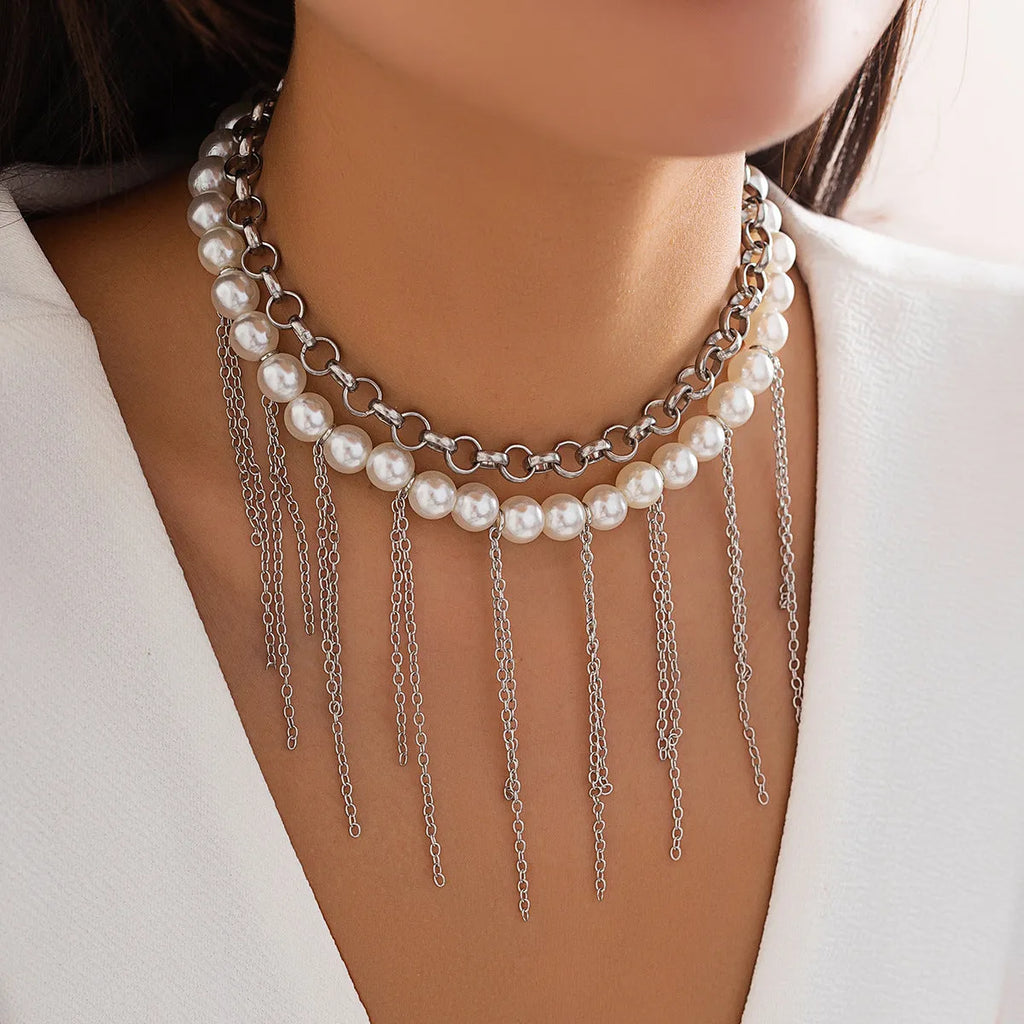 Women's double-layer retro necklace with white K electroplated finish, iron pendant, and imitation pearl tassel design