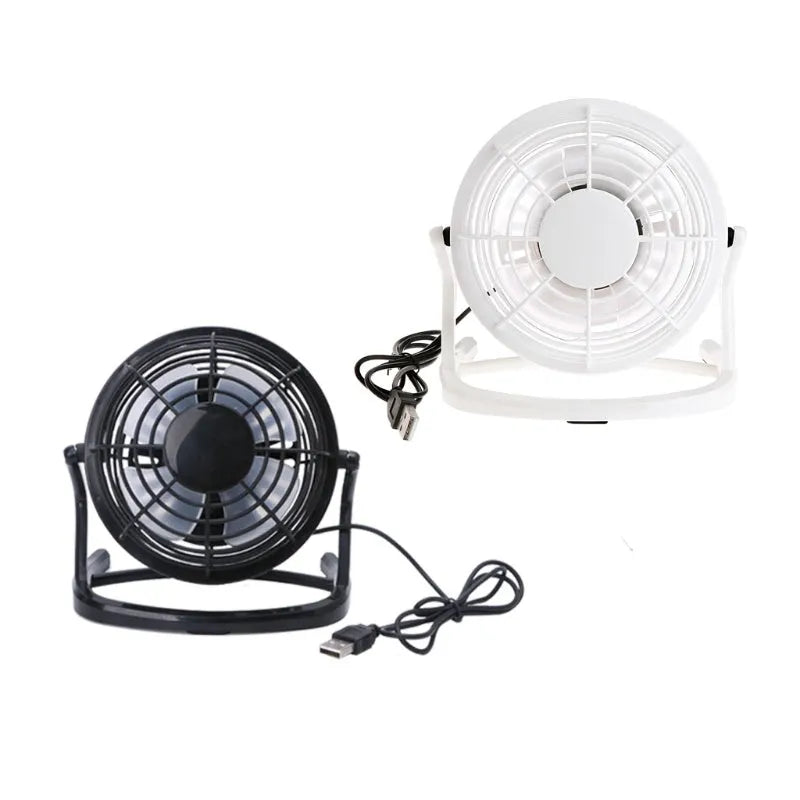 Mini adjustable USB desk fan in black, white, or blue on a workspace next to a laptop.