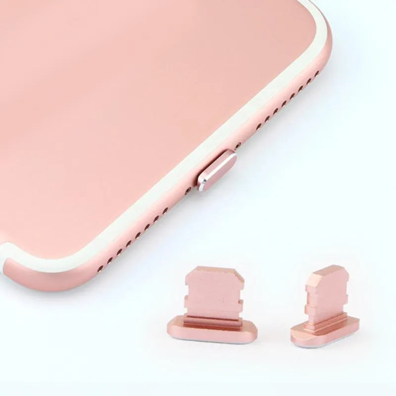 Aluminium alloy iPhone charging port dust plug shown in gold, silver, and rose gold colours.