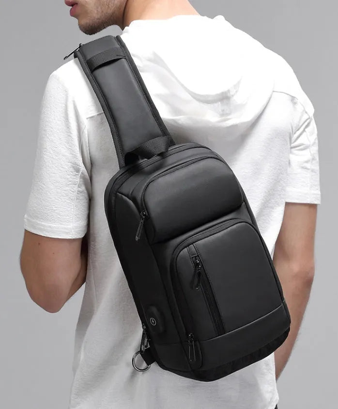 Black medium outdoor shoulder bag with square shape and air cushion strap