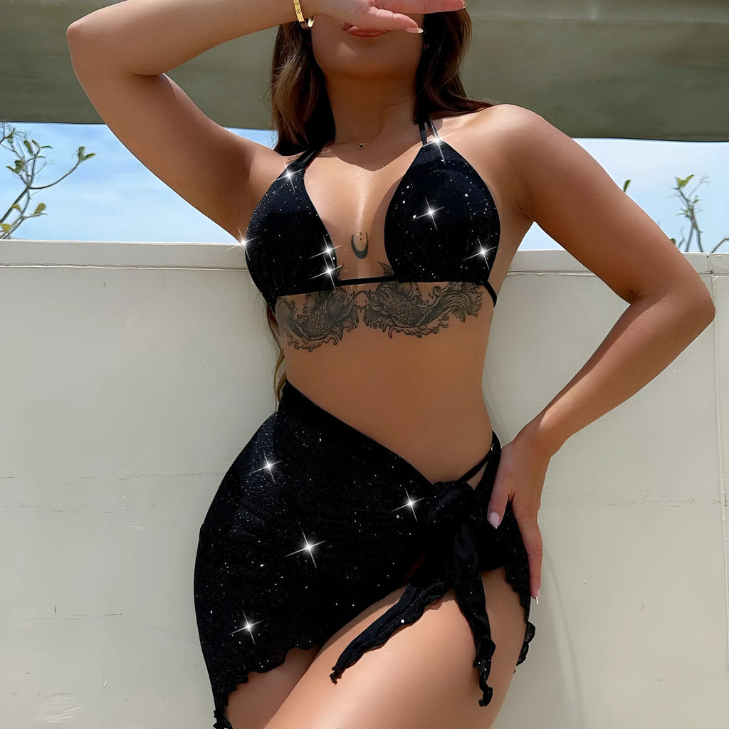 Black three-piece bikini set with triangle top and high-waisted shorts on swimwear model