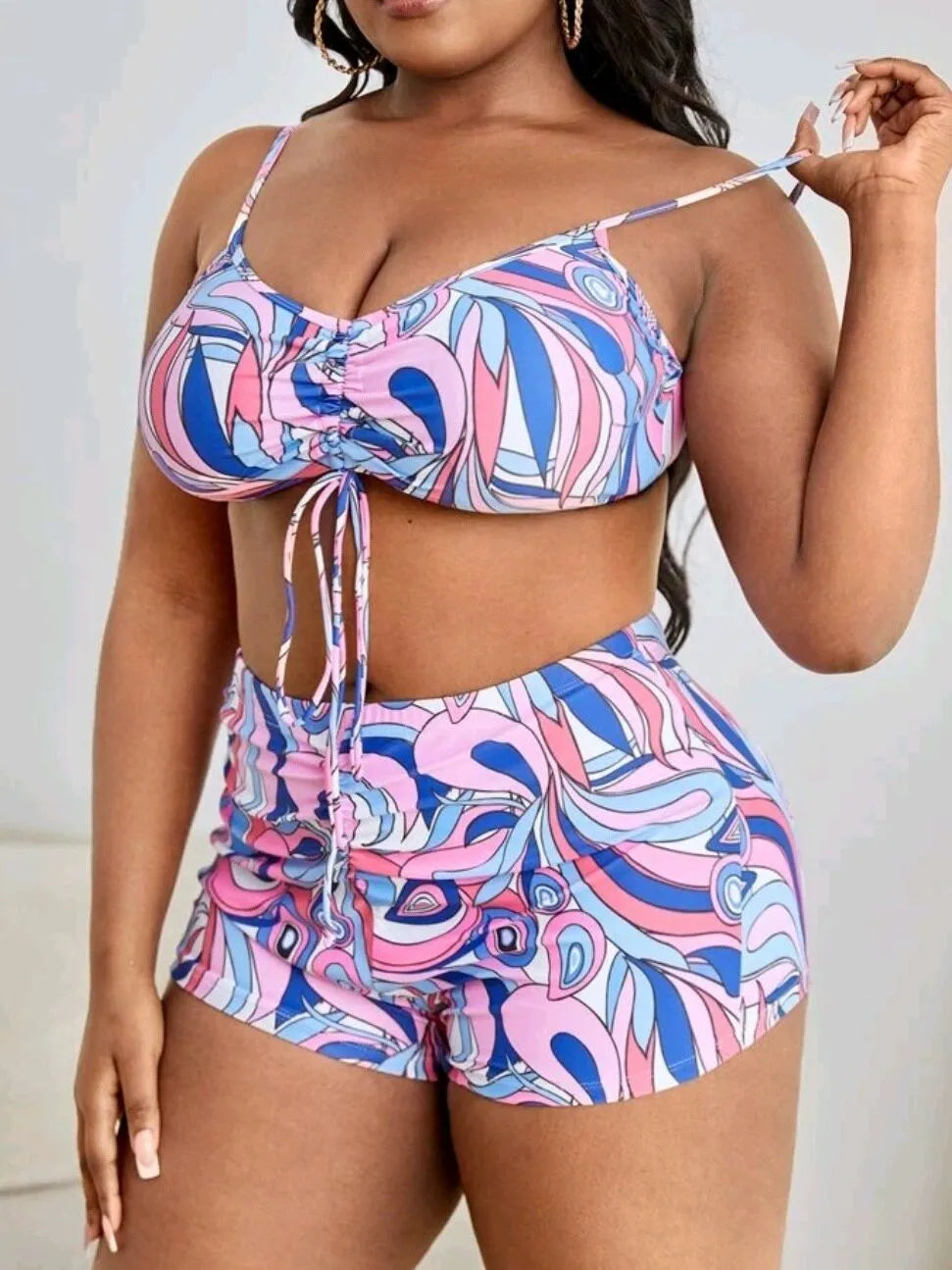 Women's floral patterned three-piece bikini set showing bra, shorts, and cardigan in plus sizes