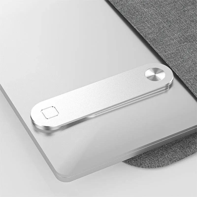 Black aluminium laptop phone holder mounted to computer monitor with smartphone attached
