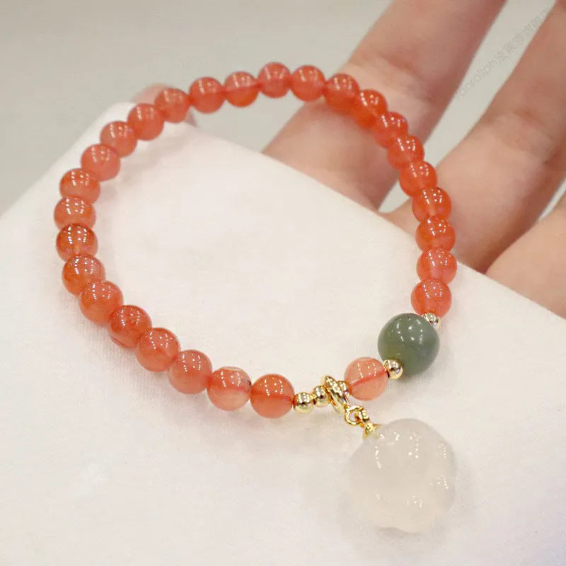 Natural red agate bracelet with cat paw design in gem inlay, 6mm width