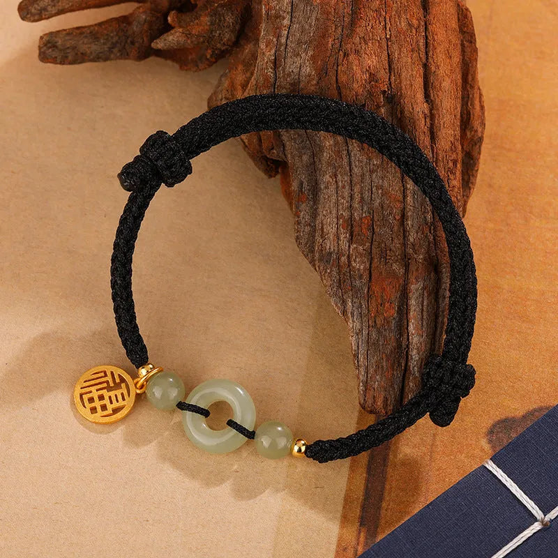 Silver geometric bracelet with a peace buckle clasp in black or wine red.