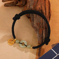 Silver geometric bracelet with a peace buckle clasp in black or wine red.