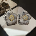Retro gardenia stud earrings with two-tone colour and textured floral design