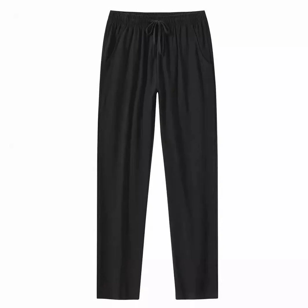 Men's loose-fitting cotton beach pants in khaki colour on a casual background.
