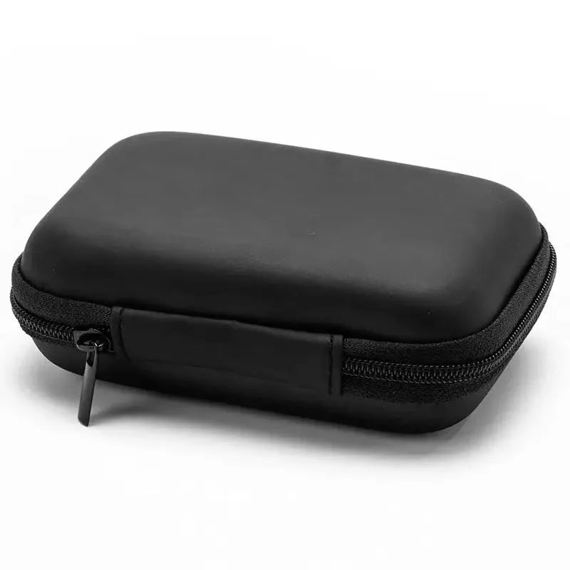 Compact black EVA travel storage box for headset cables, size 11x7.5x4 cm, on a neutral background.