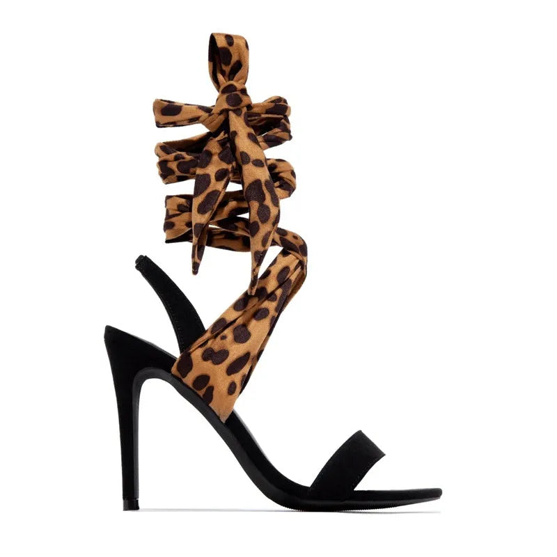 Light brown leopard print women's strappy high heel sandals with stiletto heel and cross-strap design