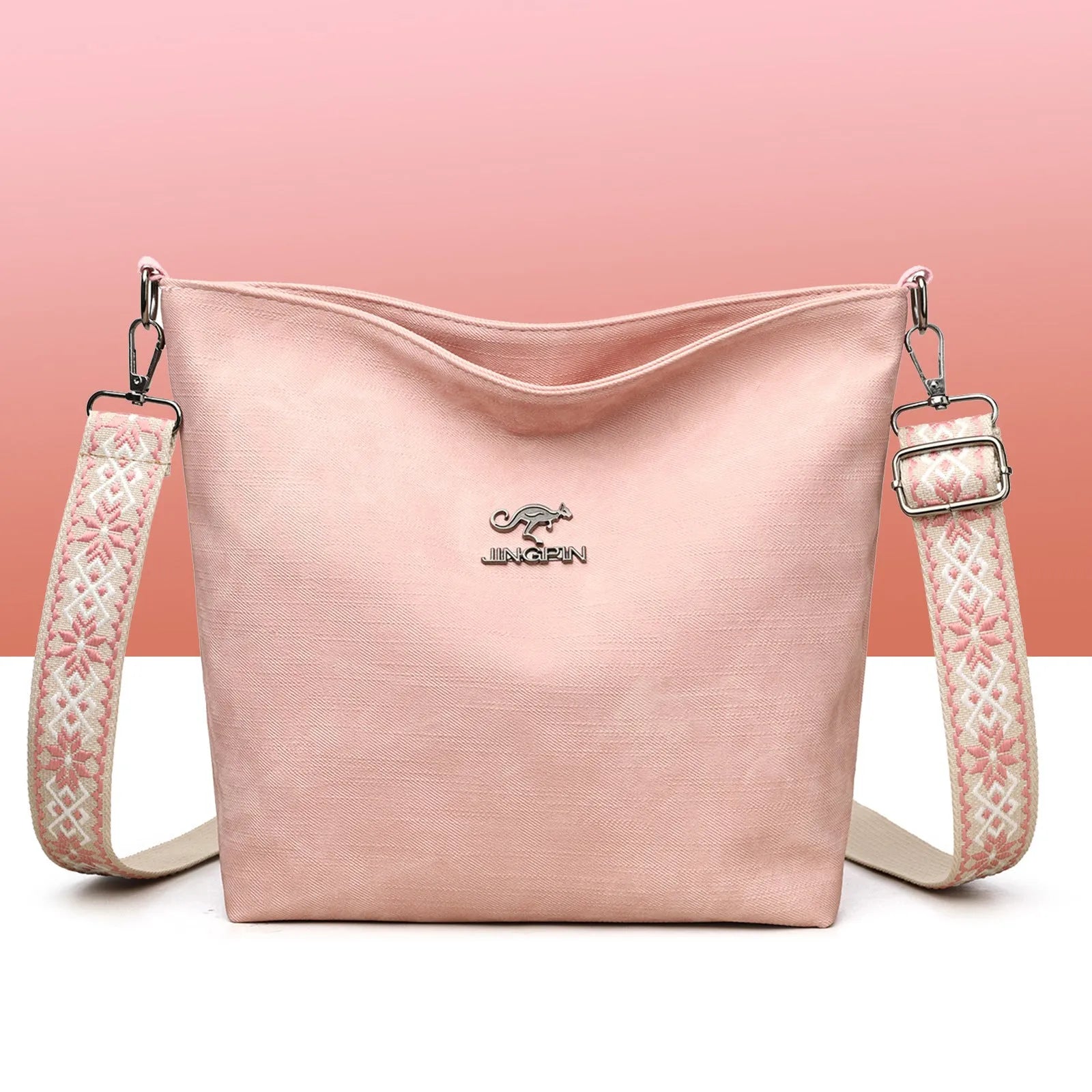 Soft grey PU crossbody bag with a large main compartment and adjustable shoulder strap