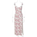 Women's long blue summer dress with lace flowers print, suspender straps, and a side slit.