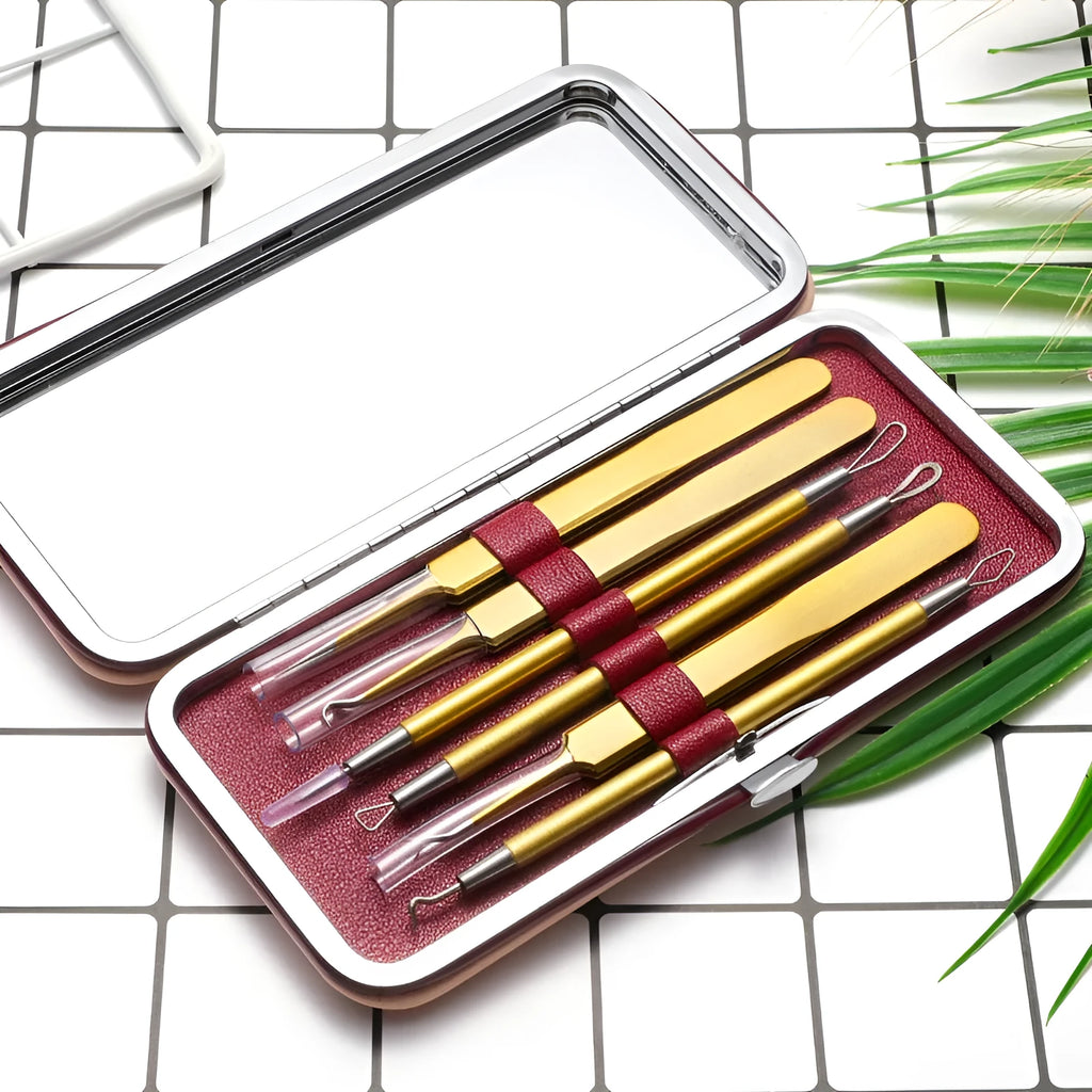 Six rose gold stainless steel acne removal tools arranged in set for facial pimple extraction