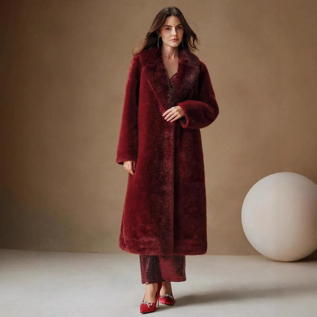 Woman wearing a long camel faux fur coat with regular sleeves, suitable for autumn and winter.