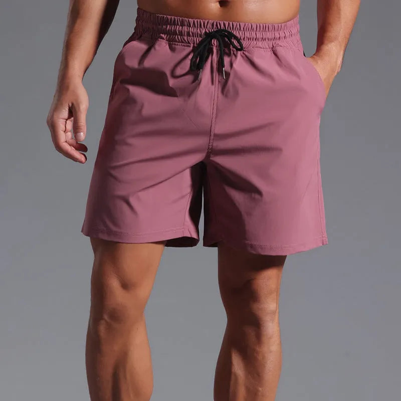 Men's loose fit quick-dry shorts in polyester available in four colours and six sizes