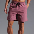 Men's loose fit quick-dry shorts in polyester available in four colours and six sizes