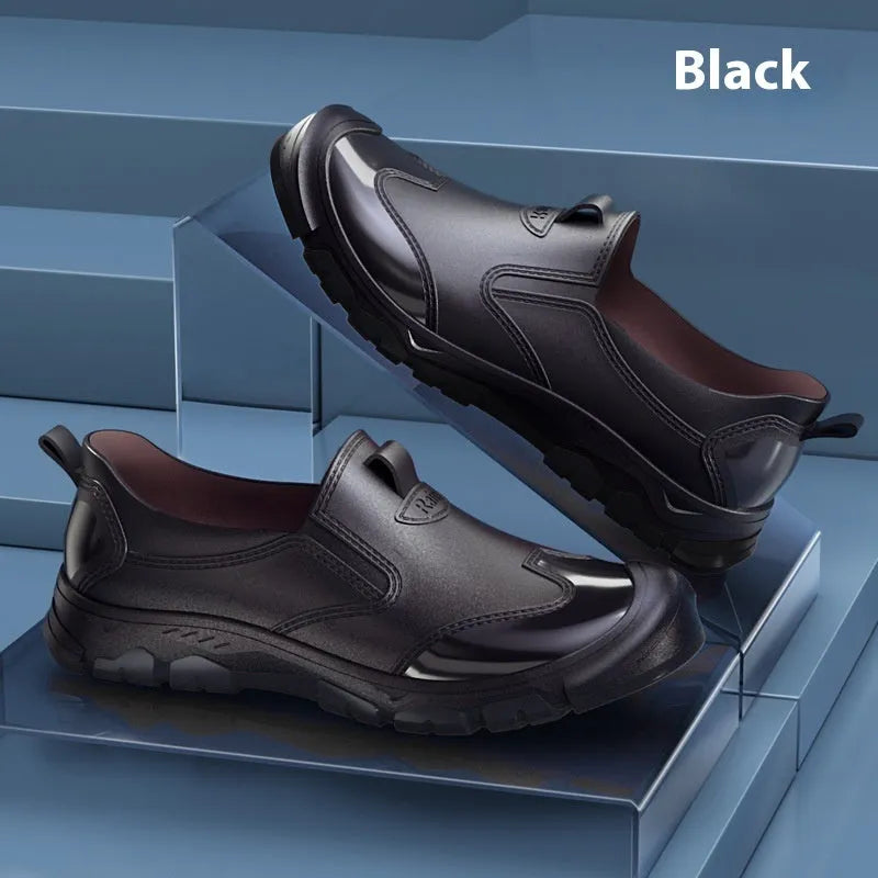 Low-cut short tube rubber rain boots in black with non-slip plastic soles.