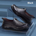 Low-cut short tube rubber rain boots in black with non-slip plastic soles.