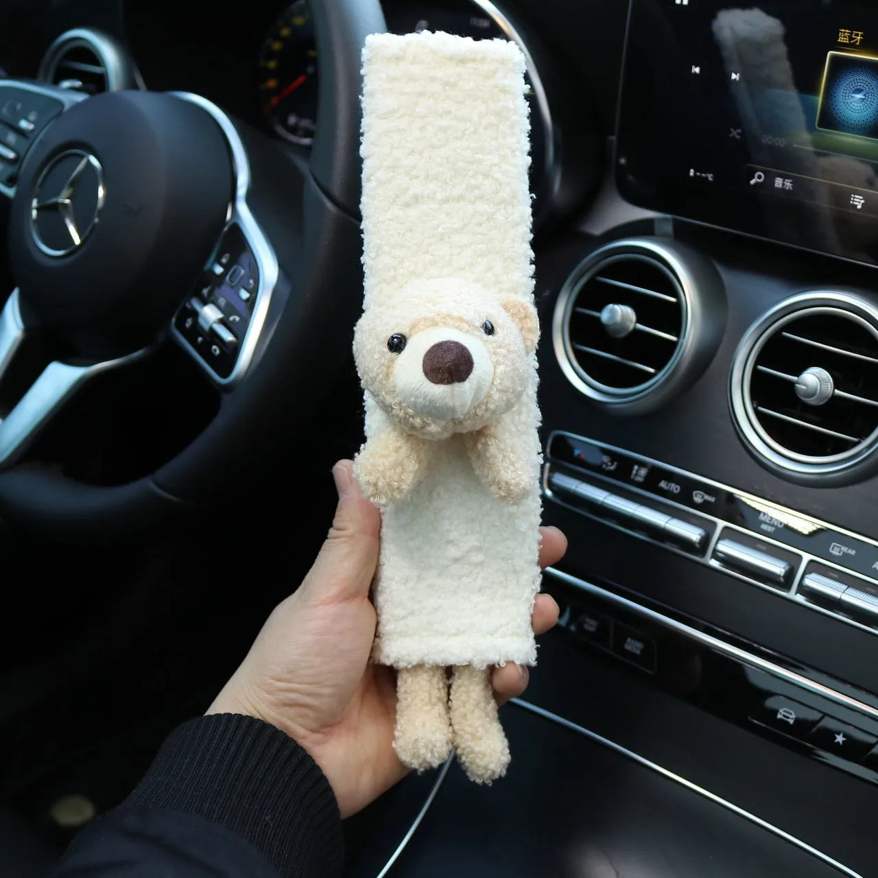 Plush lamb wool car seatbelt shoulder protector with cartoon rabbit and bear designs.