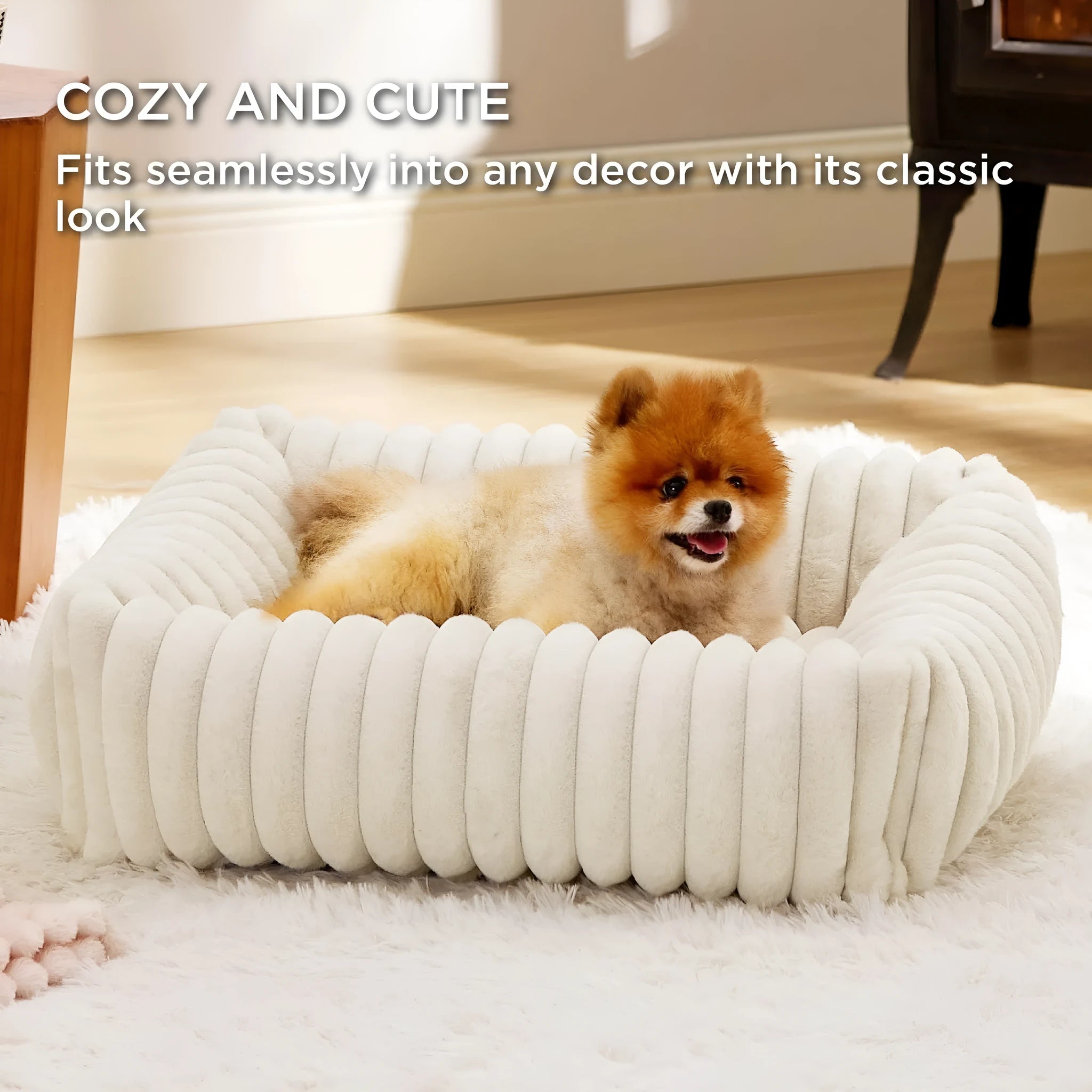 Grey pet bed with raised cushioned sides for a cat or dog.