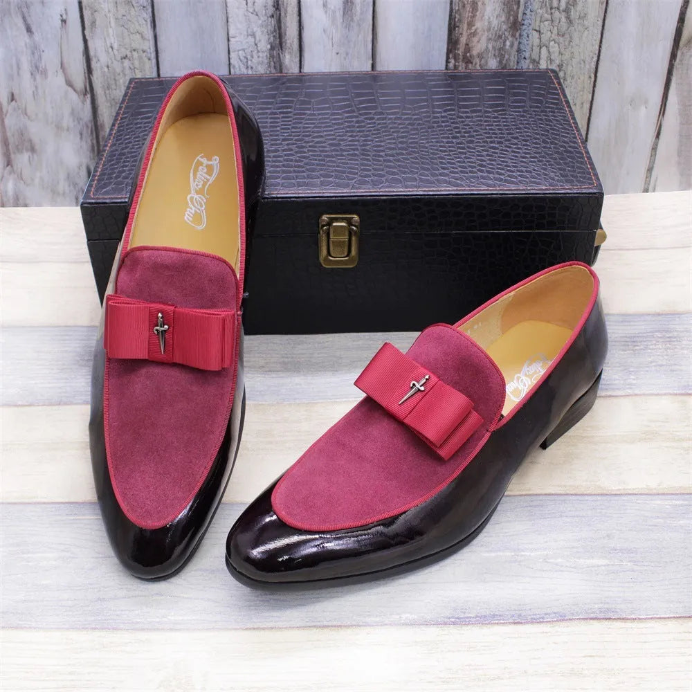 Men's black low-top leather brogue shoes with a patent leather finish and tassel detail on a rubber sole.