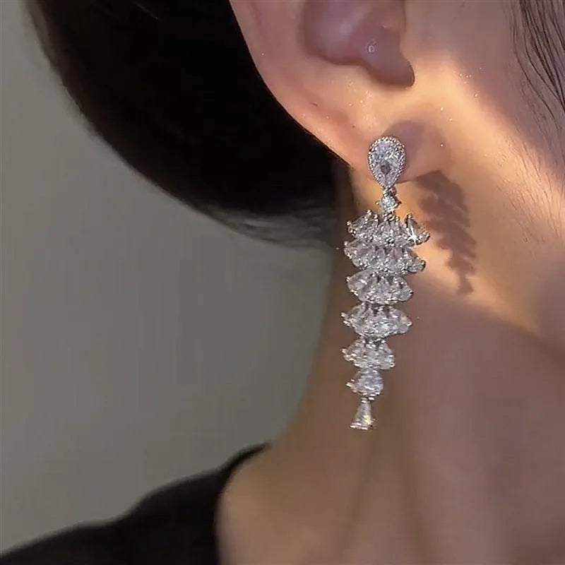 Silver pagoda colour Christmas tree drop earrings with zircon stones on copper stud setting.