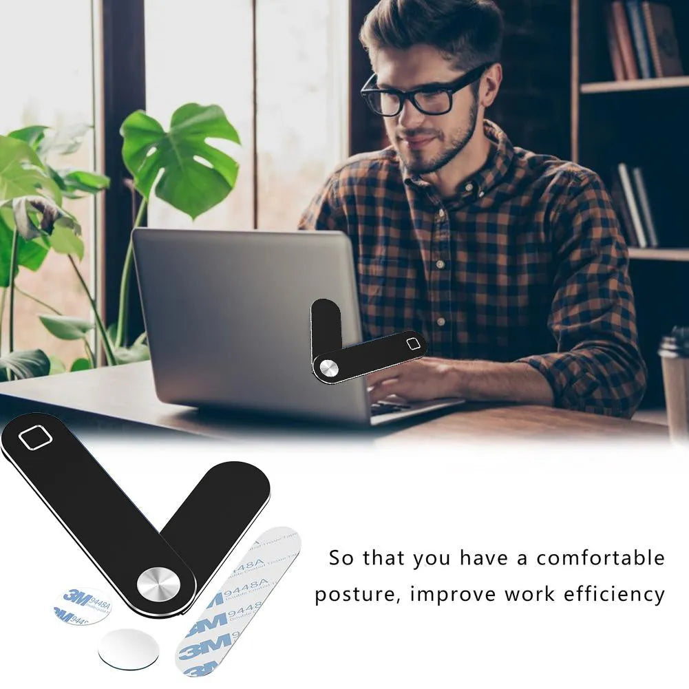 Black aluminium laptop phone holder mounted to computer monitor with smartphone attached