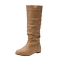 Women's black slip-on flat boots with a round toe and high cylinder shaft.
