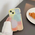 Yellow-edged minimalist contrast colour TPU silicone case on an Apple iPhone.