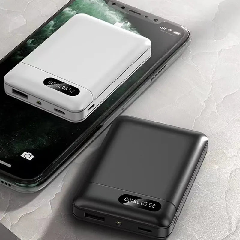 Black and white portable power bank with multiple USB ports showing front and side views.