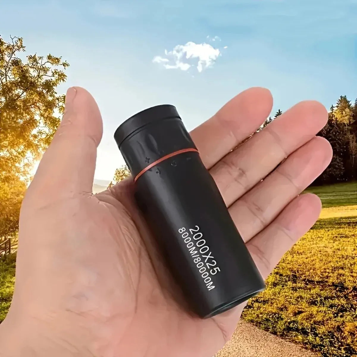 Black portable monocular telescope with a mobile phone holder attached