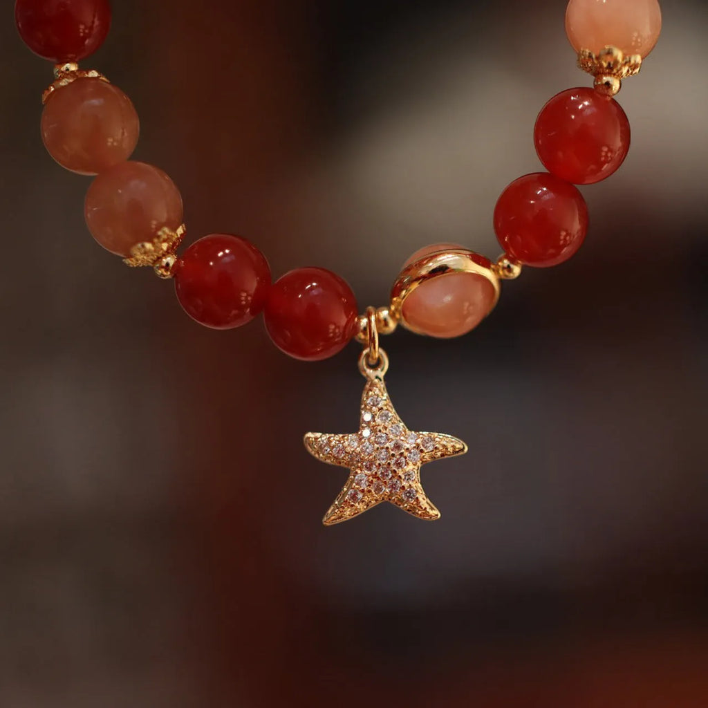Handmade women's red agate bracelet with 8mm stones and ethnic star design featuring Xiangyun elements
