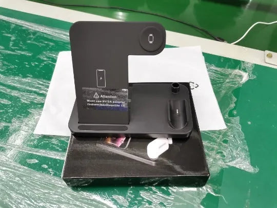 Black foldable 4-in-1 wireless charger showing MagSafe spot for iPhone and Apple Pencil charger, with EU UK US plug options.