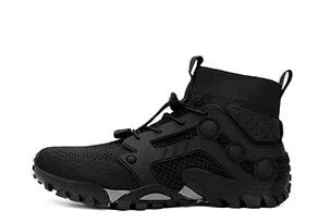 Army green outdoor climbing boots with flyknit upper and natural rubber sole on rocky ground.