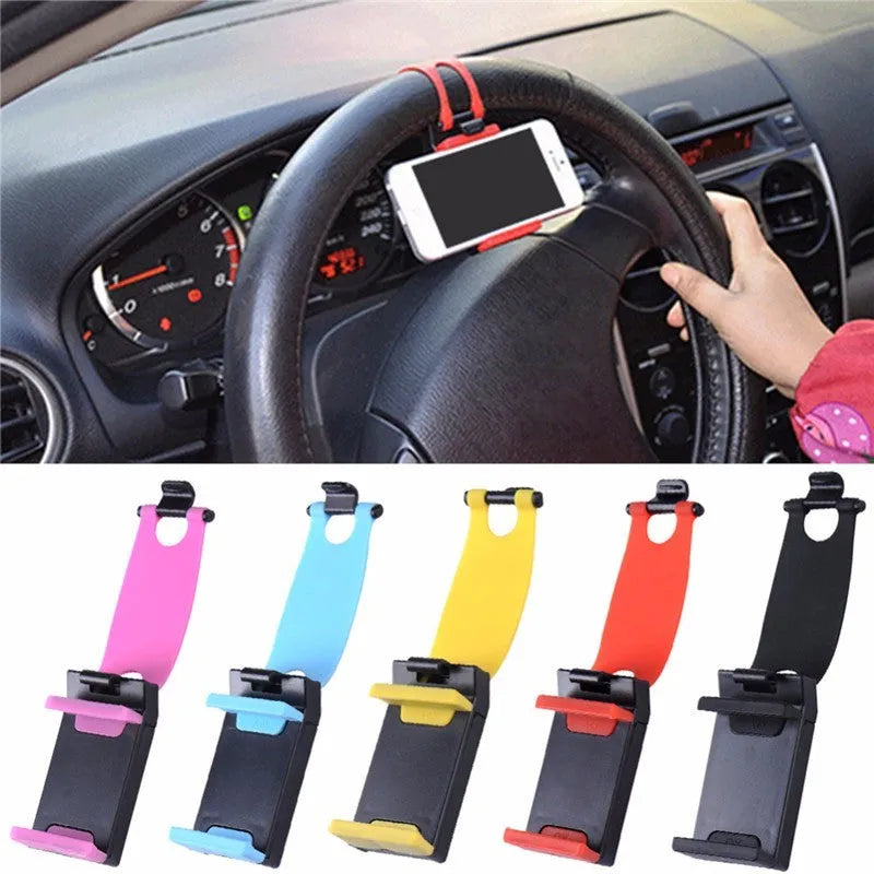 Black universal steering wheel phone holder clip mount attached to a car steering wheel.
