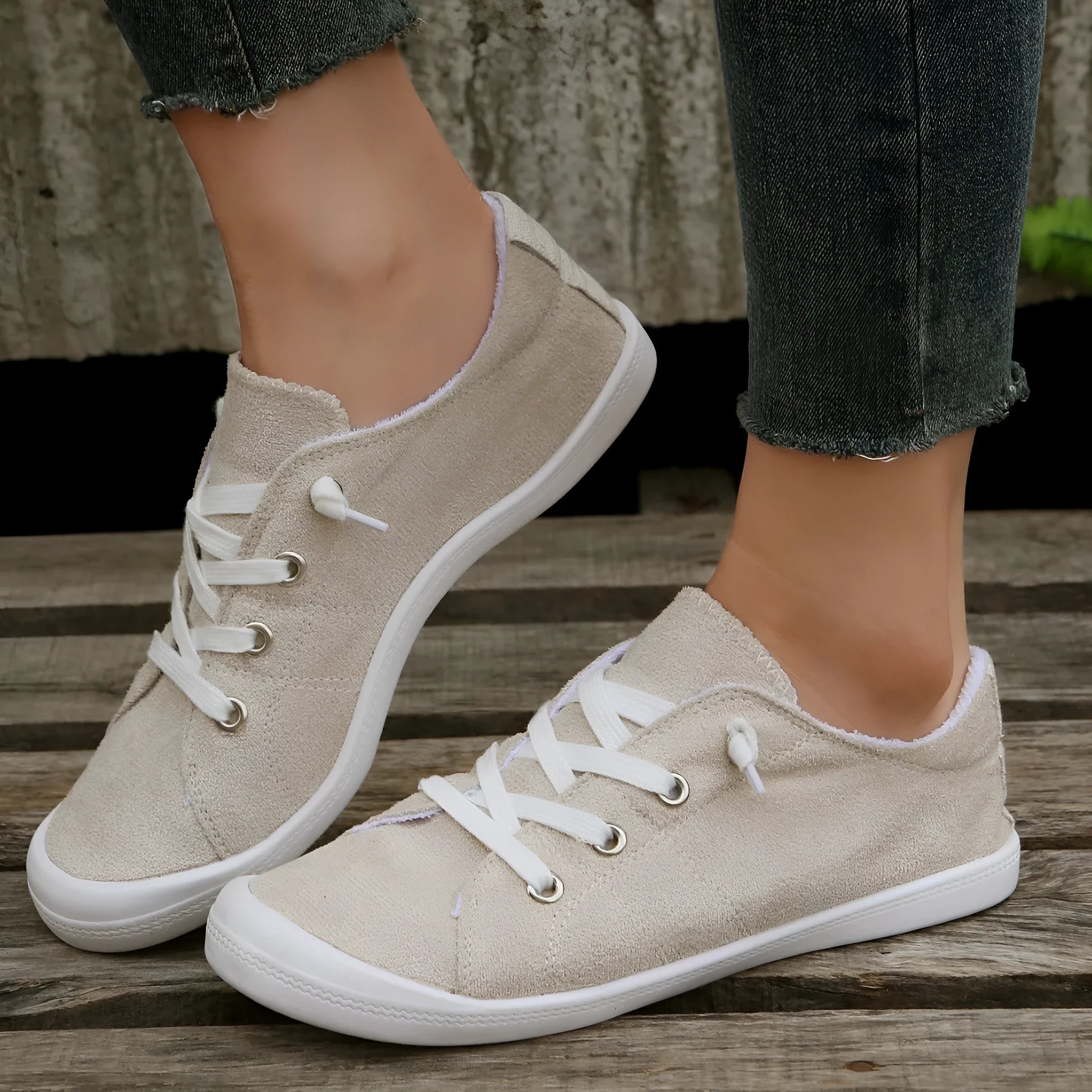 Women's creamy-white fabric casual sneakers with low-top design and rubber sole